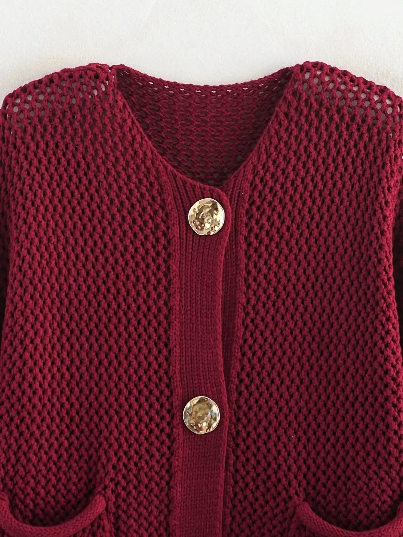 Kortstrikket cardigan med lommer og knapper til damer