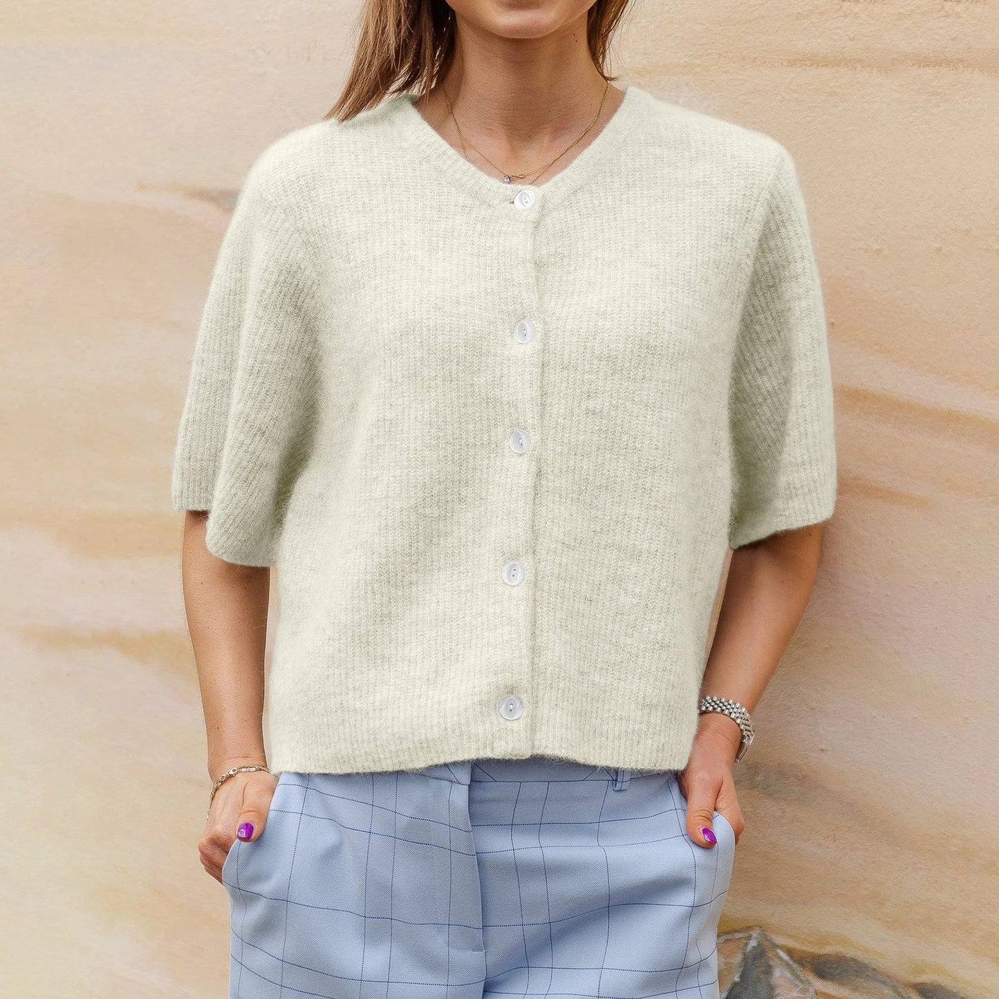 Women's short-sleeved round neck cardigan with front button closure
