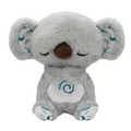Plush toy with soothing music and breathing movements