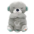Plush toy with soothing music and breathing movements