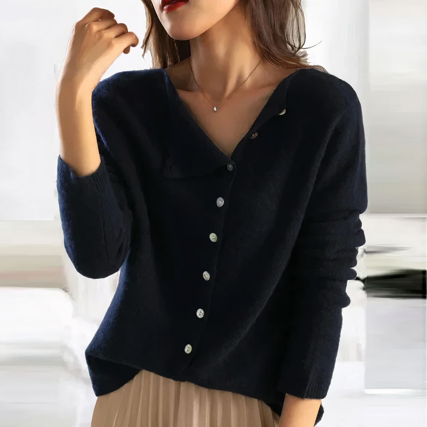 Women's V-neck cardigan with slanted button closure
