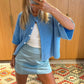 Women's short-sleeved round neck cardigan with front button closure