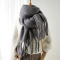 Luxurious women's cashmere scarf with large tassels for winter style and comfort