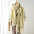 Luxurious women's cashmere scarf with large tassels for winter style and comfort