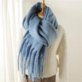 Luxurious women's cashmere scarf with large tassels for winter style and comfort