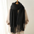 Luxurious women's cashmere scarf with large tassels for winter style and comfort