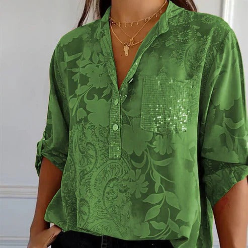 Women's blouse with collar, patterned surface and three-quarter sleeves