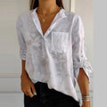 Women's blouse with collar, patterned surface and three-quarter sleeves