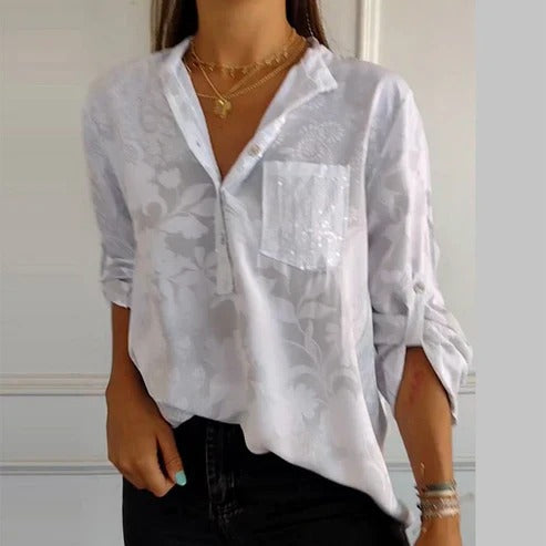 Women's blouse with collar, patterned surface and three-quarter sleeves