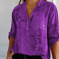 Women's blouse with collar, patterned surface and three-quarter sleeves