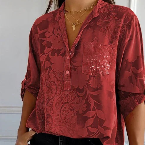 Women's blouse with collar, patterned surface and three-quarter sleeves