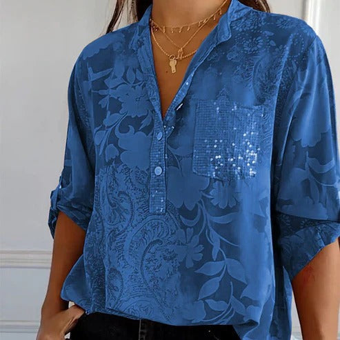 Women's blouse with collar, patterned surface and three-quarter sleeves